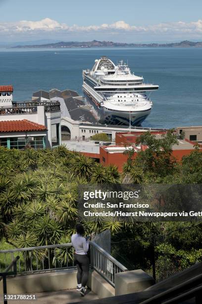 The Grand Princess whose passengers were evacuated after a coronavirus outbreak on board docks at Pier 35 for resupply as members of the Filipino...