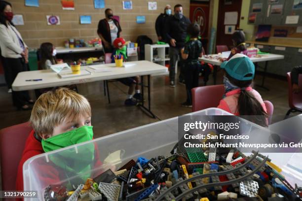 Jed Cushing plays with legos in the learning hub inside the Minnie and Lovie Ward Recreation Ctr. On Thursday, July 23 in San Francisco, Calif.