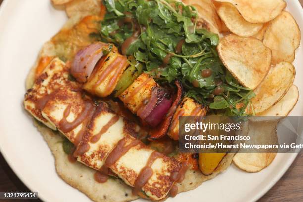 Grilled paneer kabobs--hand rolled flatbread, spiced garlic chutney--served at Besharam, a new Gujarati restaurant on Thursday, Aug. 16 in San...