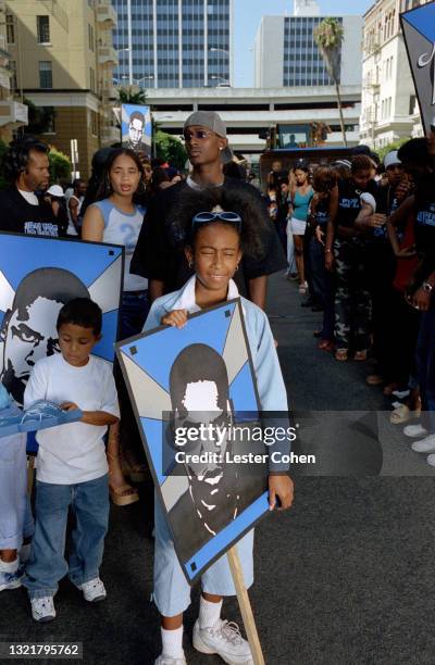 Fans of American rapper, songwriter, record executive, businessman, and media proprietor Jay-Z stand in the street as he promotes his sixth studio...