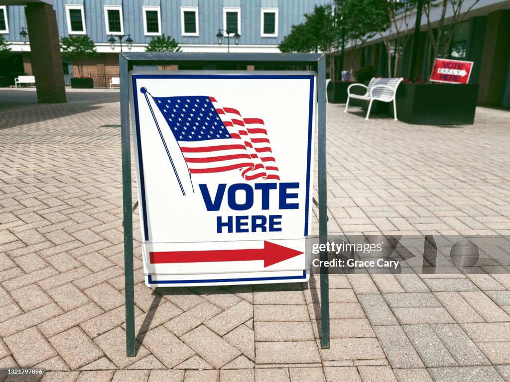 “Vote Here” Directional Sign Outside of Polling Place