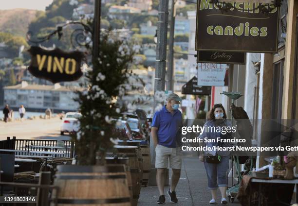 Pedestrians seen browsing stores at the waterfront on Thursday, Aug. 27 in Sausalito, Calif. Marin Countys health officer said they are starting to...