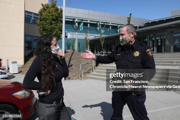Deputy probation officer Diana Chilicas talks with deputy Grogan at the entrance to the San Mateo juvenile hall seen on Thursday, Sept. 3 in San...