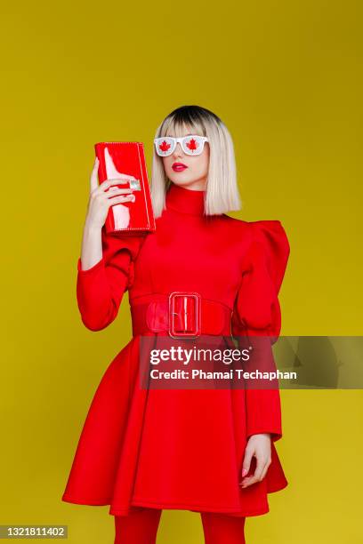 fashionable woman dresses in red - yellow retro dress stock pictures, royalty-free photos & images