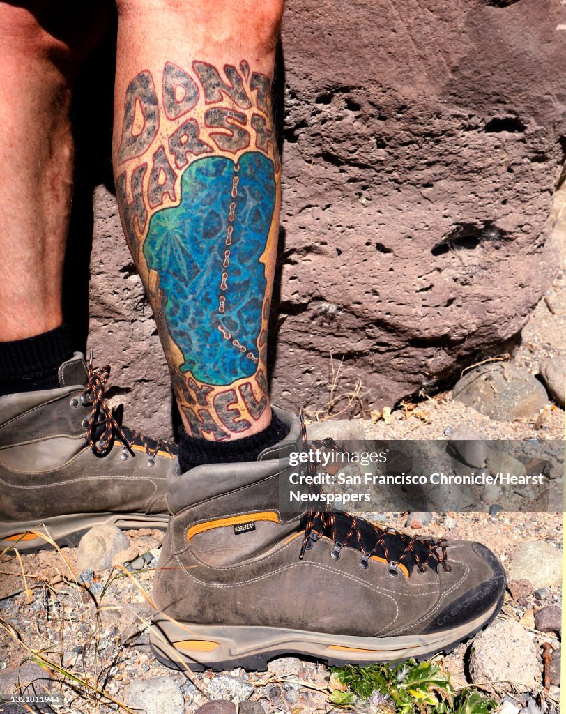 Mike Dewey of Reno, Nv. displays his Lake Tahoe tattoo, done by Mark of Truth Tattoo in Truckee, Calif., during a hike along the Tahoe-Pyramid Bikeway between Floriston and Farad, Calif., as seen on Thurs. Sept. 6, 2018.
