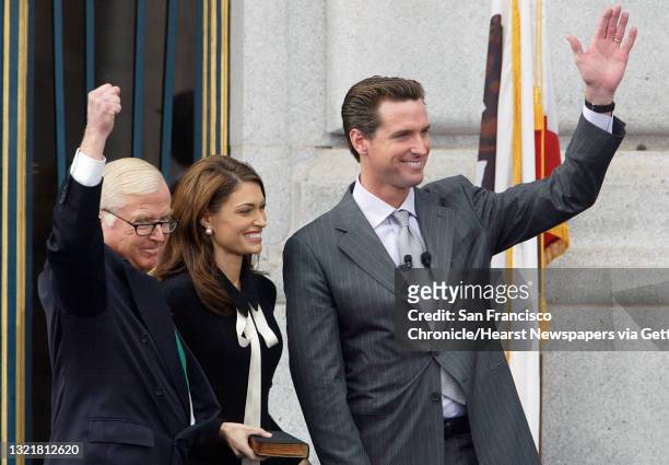 Newsome173_mac.jpg The new Mayor of San Francisco Gavin Newsom joins his father Judge William Newsom and his wife Kimberly Guilfoyle Newsom in waving...