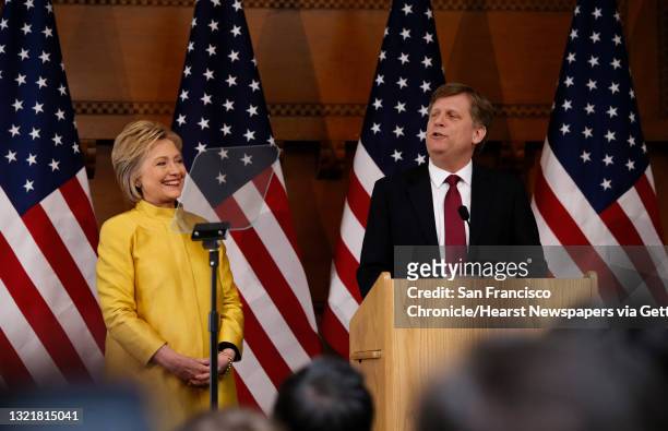 Presidential candidate Hillary Clinton is introduced by MIchael McFaul former United States Ambassador to Russia, as she prepares to deliver a...