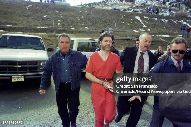 Theodore "Ted" Kaczynski, center, is guided to his arraignment in Helena, Montana on April 4, 1996 following his arrest in connection with the...