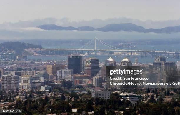 Looking across the bay to the skyline of Oakland, the Bay Bridge and the Marin Headlands from the hills of Oakland, California on Fri. Aug. 12, 2016.