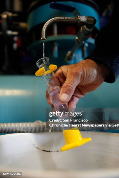 Allen Roseberry, a water utility foreman for the City of Healdsburg takes a water sample at the water treatment plant where fluoride is added to the...