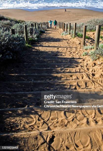Visitors along the California Coastal Trail climb the Sand Stairs from Baker Beach in San Francisco, California, on Friday December 30, 2016.