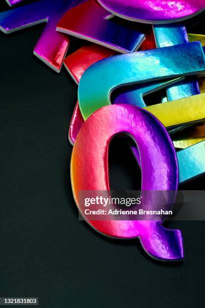 foil letter q - qanon conspiracy stock pictures, royalty-free photos & images