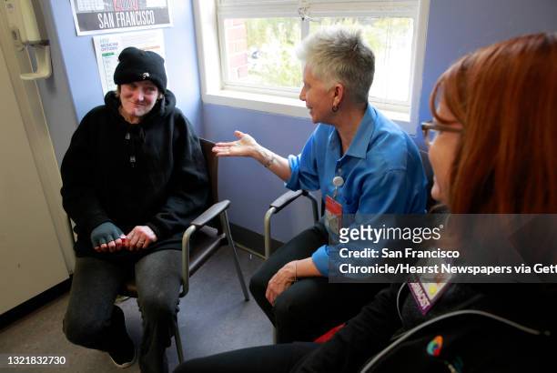 Patient Pamela Phelan, meets with RN Valerie Robb, and pharmacist Janet Grochowski during an appointment in San Francisco Ca. On Thursday Feb. 2,...