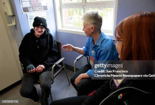 Patient Pamela Phelan, meets with RN Valerie Robb, and pharmacist Janet Grochowski during an appointment in San Francisco Ca. On Thursday Feb. 2,...