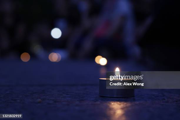 Candles are lit during a candlelight vigil to mark the 32nd anniversary of the June 4th Tiananmen Square massacre at Freedom Plaza June 4, 2021 in...