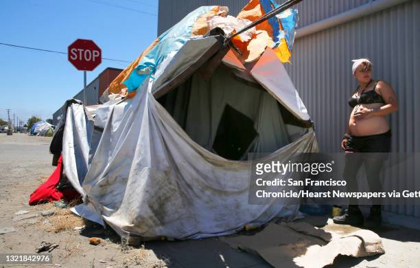 Samatha, 22 who is 8 months pregnant and been homeless for 5 years is living in an encampment on the corner of Cedar and 2nd streets in Berkeley,...