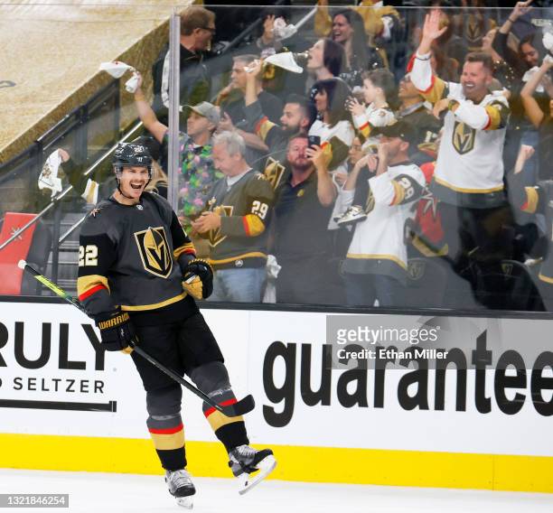 Vegas Golden Knights fans celebrate as Nick Holden of the Vegas Golden Knights smiles after assisting Max Pacioretty on a third-period goal against...