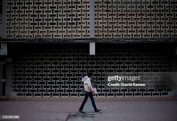Woman walks in Ciutat Meridiana, a suburb with one of the Barcelona's highest unemployment rates on November 9, 2011 in Barcelona, Spain. TThe...