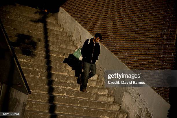 Man walks down a stairs in Ciutat Meridiana, a suburb with one of the Barcelona's highest unemployment rate on November 9, 2011 in Barcelona, Spain....