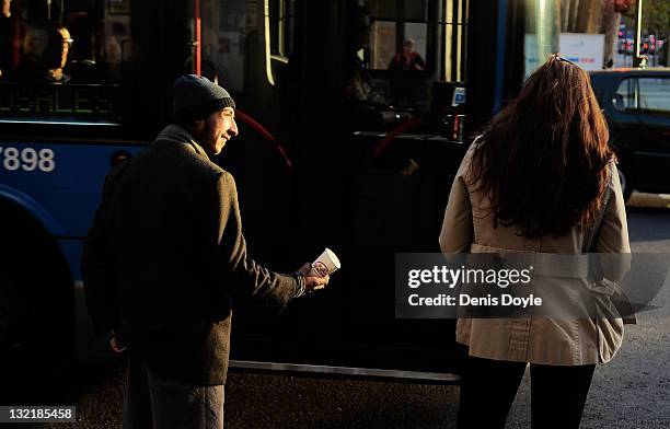 Man begs for money at Calle Serrano on November 8, 2011 in Madrid, Spain. The current Eurozone debt crisis has left Spain with crippling economic...