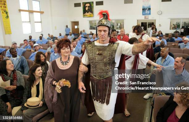 Julius Caesar, played by Azraal Ford and his wife Calpurnia played by Shelley Johnson, make an entrance past the audience into a scene as inmates...