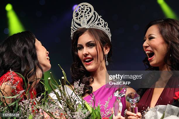 Newly-crowned Miss Universe Malaysia 2012 Kimberley Leggett shares a moment with first runner-up Gabriella Robinson and second runner-up Boon Lu...