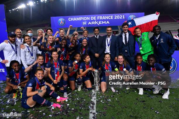 Paris Saint-Germain Women players and President Nasser AL Khelaifi pose with the trophy winning the championship with the trophy after the D1 Arkema...