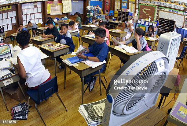 Students in Ms. Newman''s third grade class attend summer school June 3, 2001 at Brentano Academy in Chicago. More than half of Chicago''s 430,000...