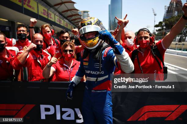 Race winner Robert Shwartzman of Russia and Prema Racing celebrates with team members in parc ferme after winning the sprint race 1 of Round 3:Baku...