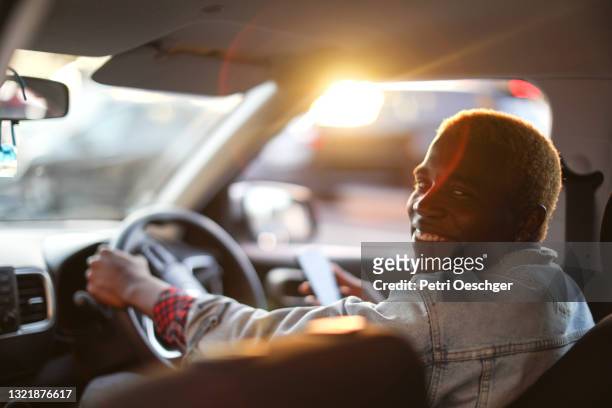 uber driver waiting for his passenger. - africa road stock pictures, royalty-free photos & images