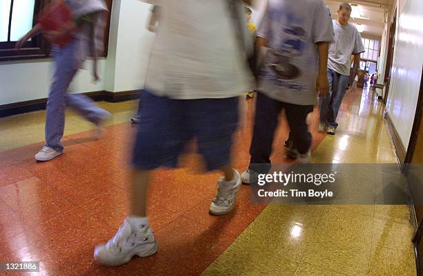 Students hustle through a hallway between classes during summer school July 3, 2001 at Brentano Academy in Chicago. More than half of Chicago''s...