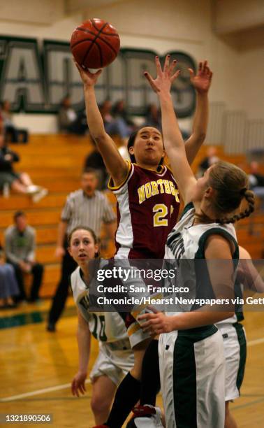 Miramonte15_072_mac.jpg Northgate's 25- Jenny Inouye goes up for a shot over Miramonte's 13- Christine Ent in the first half. High School Girls...