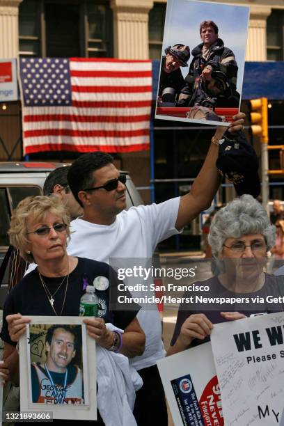 911nyc_09_096_mac.jpg l to r- Rosemarie Reina, holds a photo of her son Joseph, Larry Fraser , his firefighter friend Robert Foti and Rosemaryt Cain,...