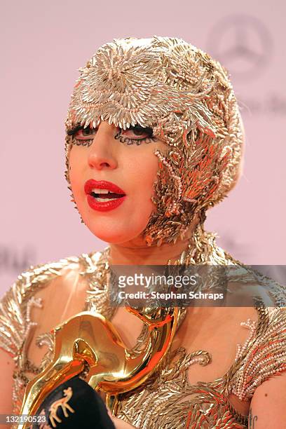 Lady Gaga poses in front of the winners board during the Bambi Award 2011 ceremony at the Rhein-Main-Hallen on November 10, 2011 in Wiesbaden,...