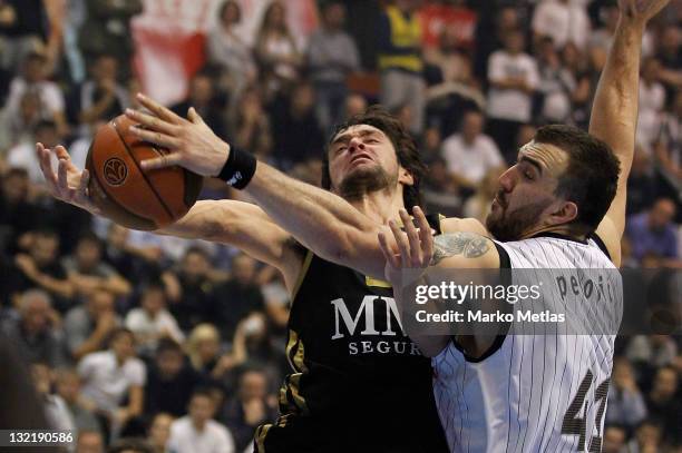 Nikola Pekovic of Partizan MTS Belgrade competes with Sergio Llull of Real Madrid during the 2011-2012 Turkish Airlines Euroleague Regular Season...