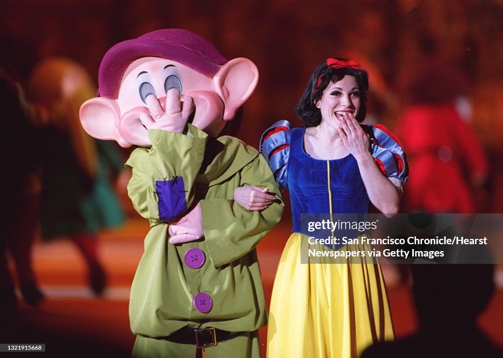 SNOW WHITE1/C/14FEB96/DD/MACOR    Walt Disney's World on Ice " Snow White and the Seven Dwarfs" at the cCow Palace SF.  Dopey and Snow White share a laugh. Chronicle Photo: Michael Macor