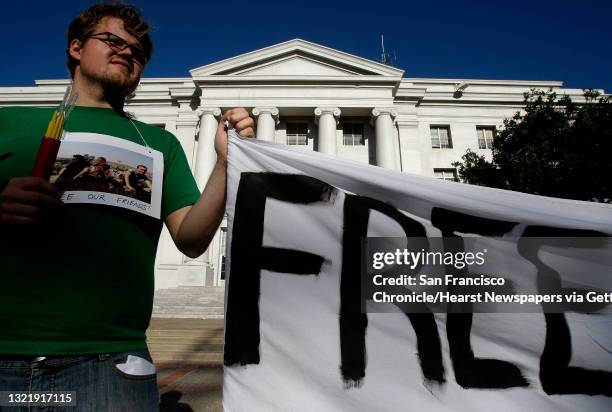 Kermit Playfoot, joins a handful of supporters during a vigil at Sproul Plaza on the UC Berkeley campus, on Wednesday September 30 . In support of...