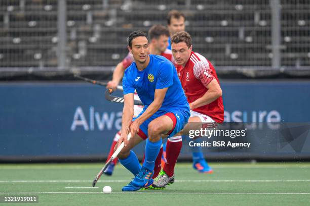 Evgeny Artemov of Russia, Harry Martin of England during the Euro Hockey Championships match between England and Russia at Wagener Stadion on June 5,...