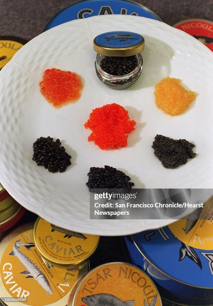 CAVIAR 1/C/06MAY96/FD/MACOR clockwise from top, Beluga sturgeon, american golden, american sturgeon, farmed ostera sturgeon, ostera sturgeon, gold pearl and flying fish, center. Chronicle photo: Michael Macor