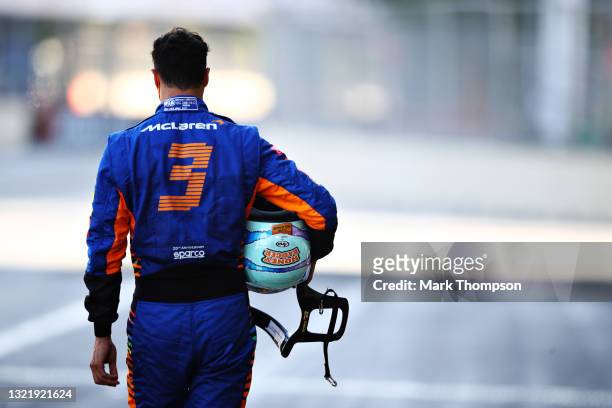 Daniel Ricciardo of Australia and McLaren F1 looks dejected as he walks in the Pitlane after crashing during qualifying ahead of the F1 Grand Prix of...