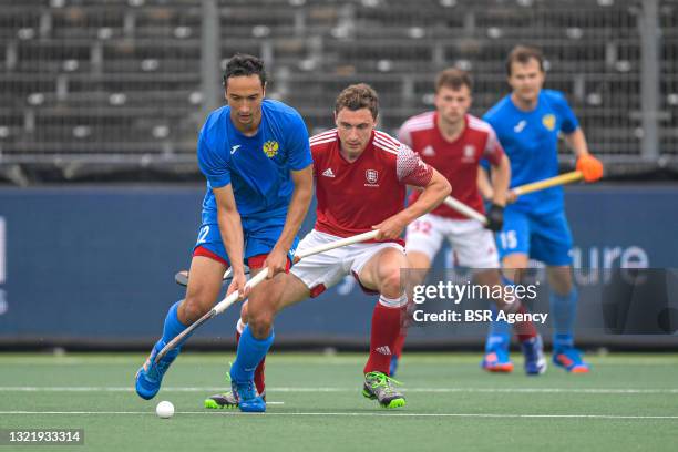 Evgeny Artemov of Russia, Harry Martin of England during the Euro Hockey Championships match between England and Russia at Wagener Stadion on June 5,...