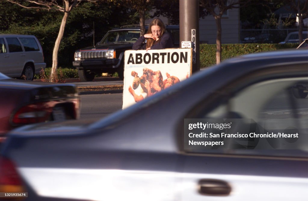 ABORTION 3/C/18NOV98/PZ/MAC Anti-abortion protesters rally against Menlo Park's new ordinance that limits the size of signs protesters can display in peacefull non-violent gatherings. They want to be able to show giant signs showing an abort