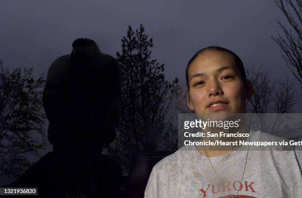 Katrina Inong, 15 of Willow Creek Ca. Stands in front of a wooden carving of the legendary Bigfoot figure. Back in 1995 or 1996, Inong claims to have...