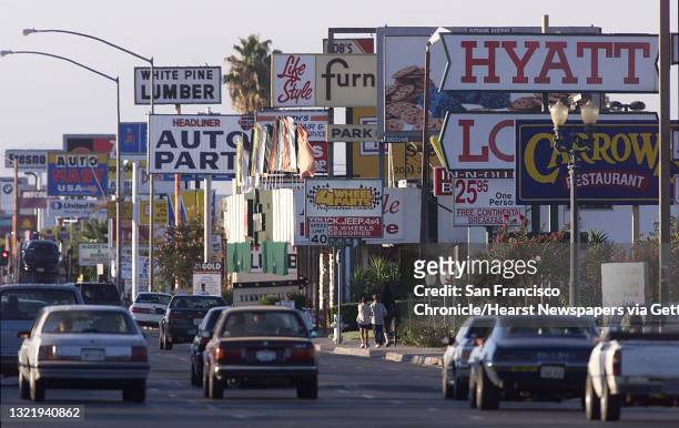 The City of Fresno. Looking down Blackstone Avenue in the middle of the city, with dozens of business signs that line the street. By Michael...
