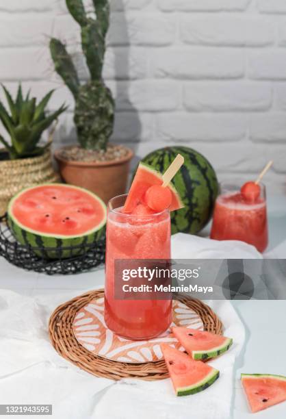 fresh watermelon juice smoothie with fruit melon skewers - cocktail recipe stock pictures, royalty-free photos & images