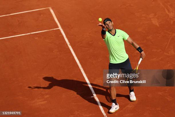 Rafael Nadal of Spain serves during his Men's Singles third round match against Cameron Norrie of Great Britain on day seven of the 2021 French Open...