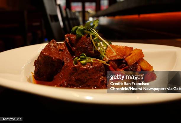 Boneless beef short rib simmered in an adobo sauce, braised Yukon potatoes, one of the many items on the menu at, "Reposado" restaurant, a new Cass...