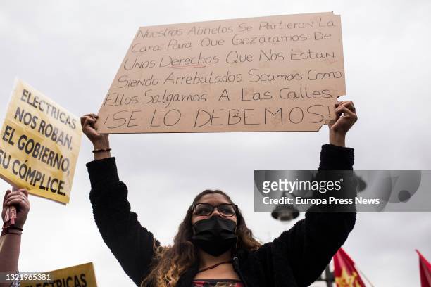 Citizen with a banner during a demonstration against the rise of light in the Puerta del Sol, on 5 June, 2021 in Madrid, Spain. This is one of the...