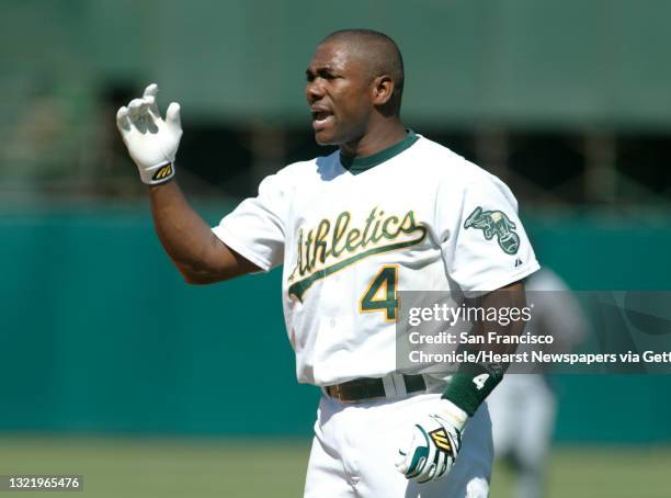 Athletics188_mac.jpg A's 4- Miguel Tejada throws his helmet after grounding out in the 5th inning with one runner on to end the inning. Oakland...