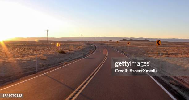 scenic view of desert road at sunrise - road marking stock pictures, royalty-free photos & images